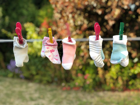 baby socks on the line