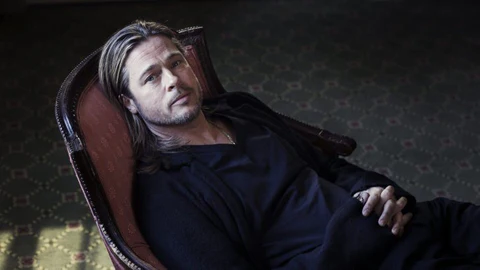 brad pitt sitting in the chair
