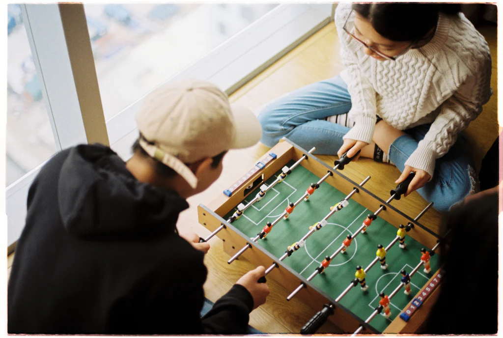 a couple play table football