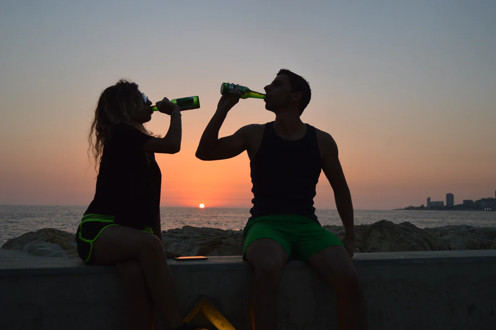 drinking beer during sunset