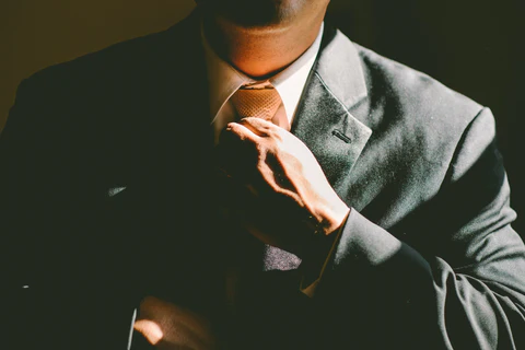 a man wearing a gray suit