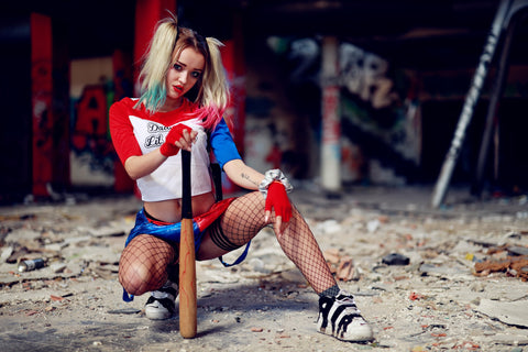 a woman wears harley quinn's costume