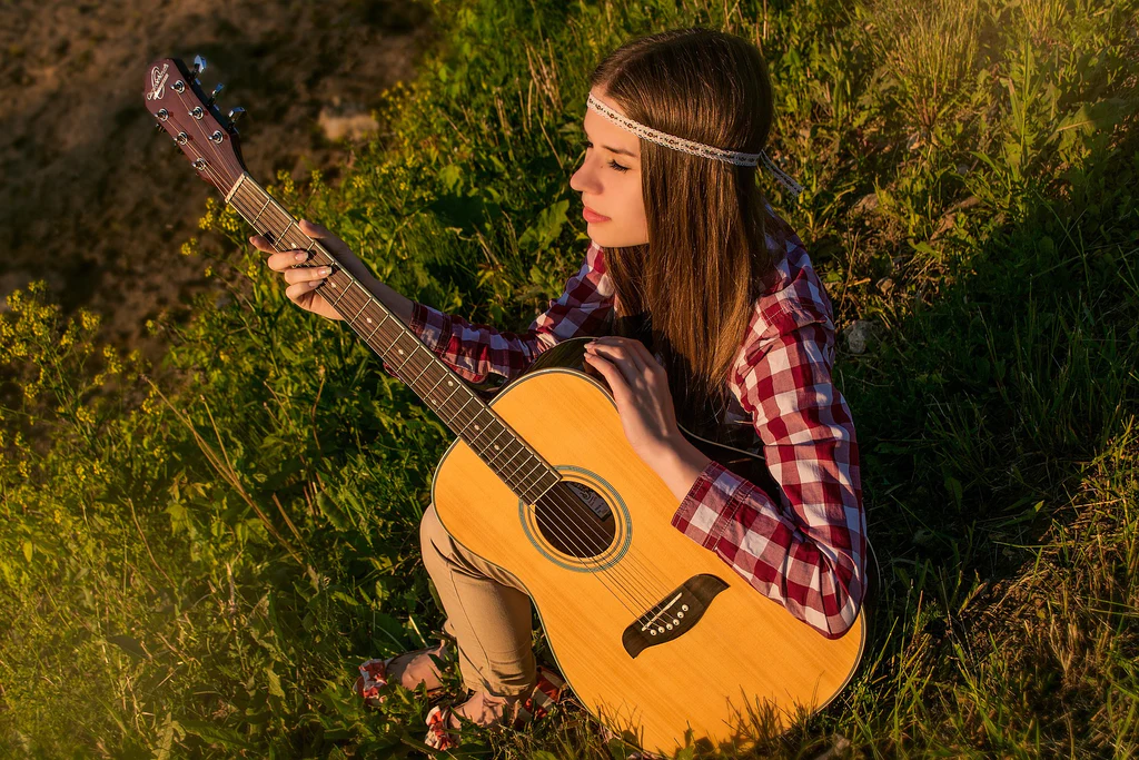 a hippie girl with a guitar