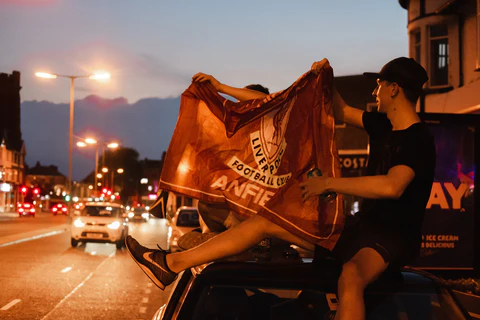 liverpool fan with a flag