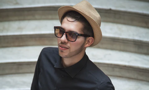 an attractive man in a black shirt