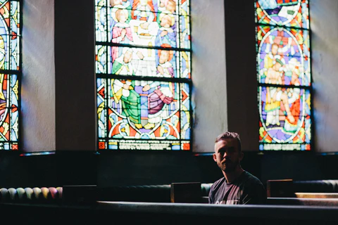 a man in church wearing t-shirt