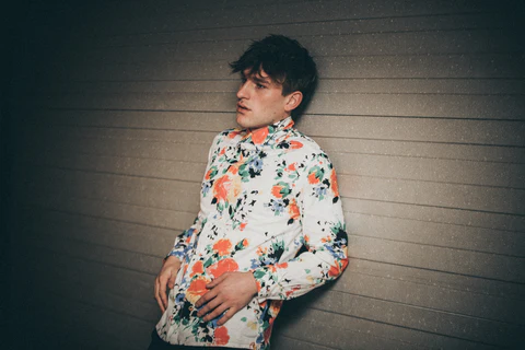 a man wearing a floral shirt