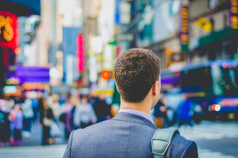 a man wearing a suit in the street