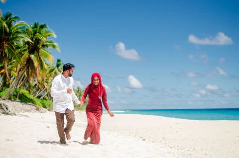 muslim couple on a beach