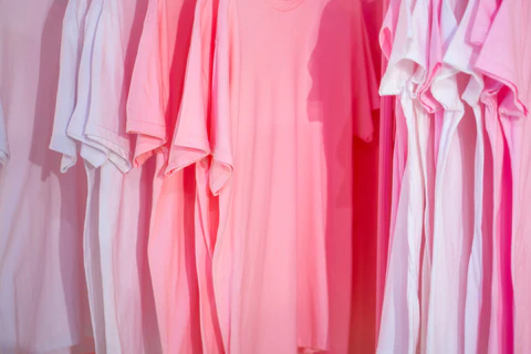 pink t-shirts on hangers