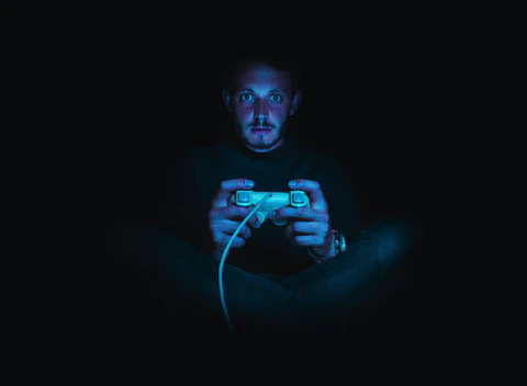 a gamer playing in the dark