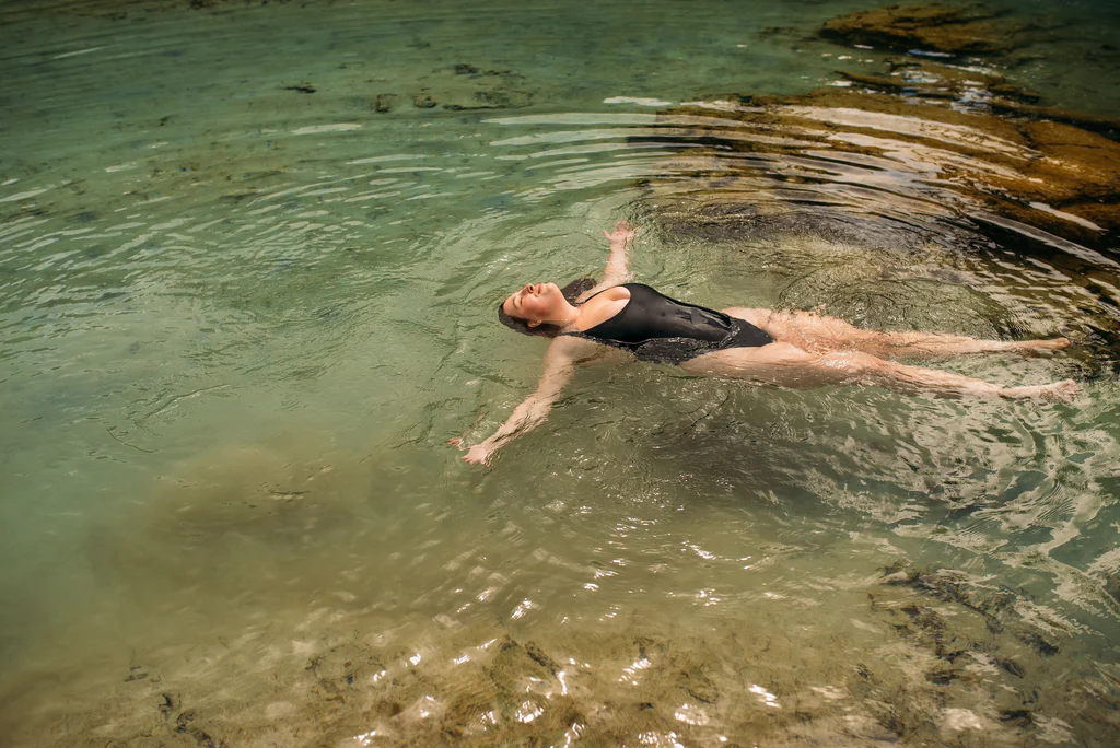 a pretty plus size woman in water