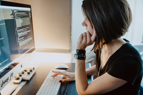 a programmer woman at a desk