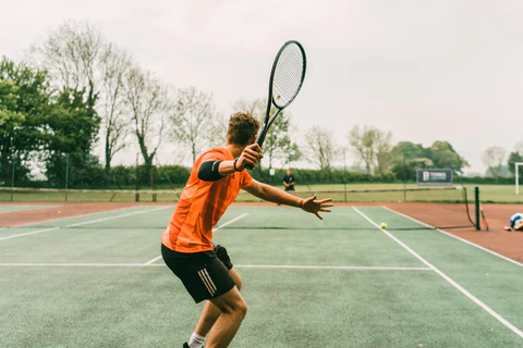 playing tennis in tennis tshirt