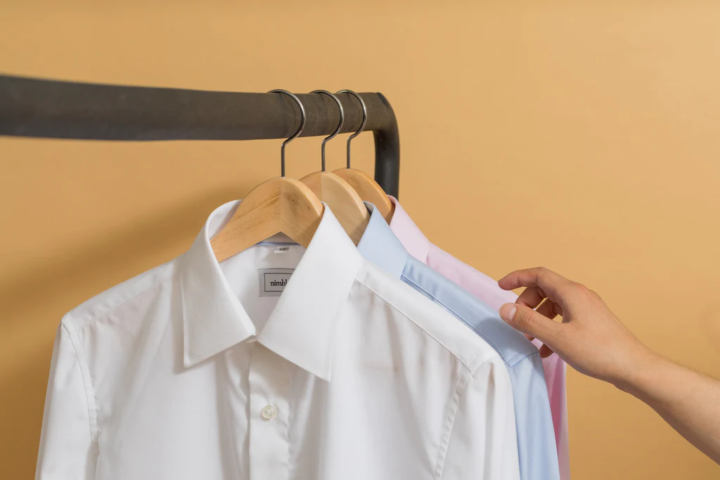 three collar shirts on the hangers 