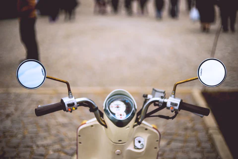 vespa riding in the street
