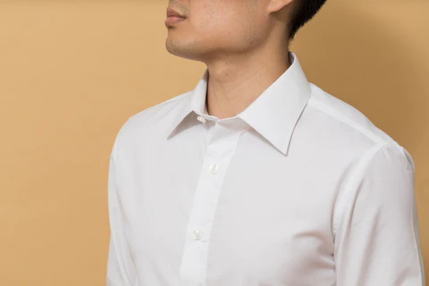 a man in a white collar shirt