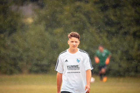 a man in a white jersey