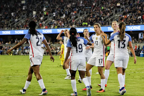 women football players wearing jerseys