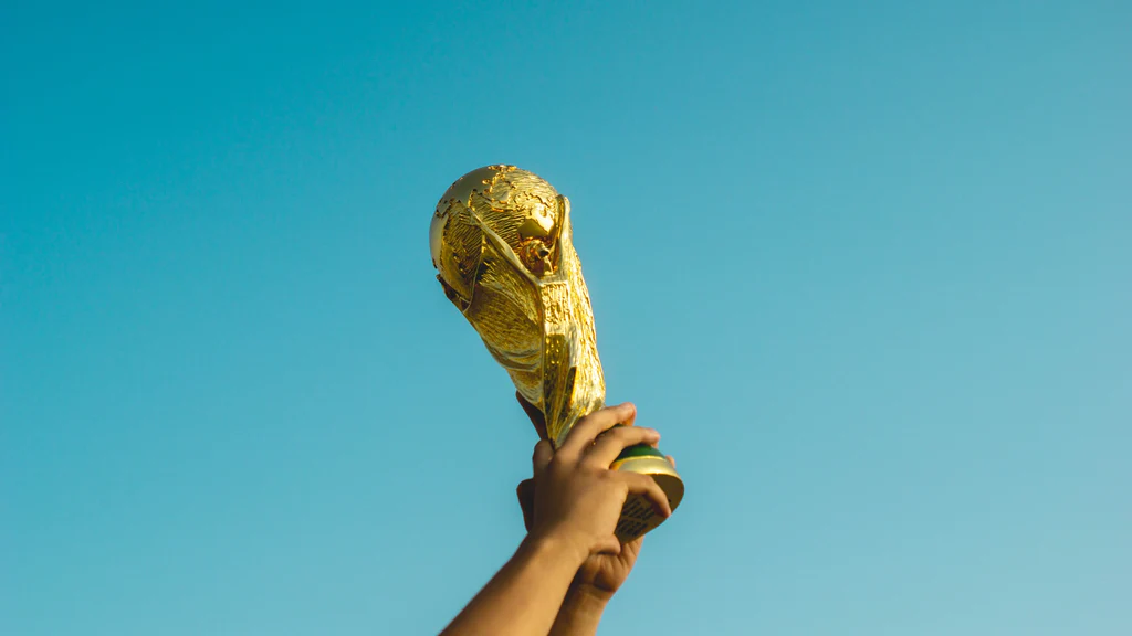 the fifa world cup trophy in hand